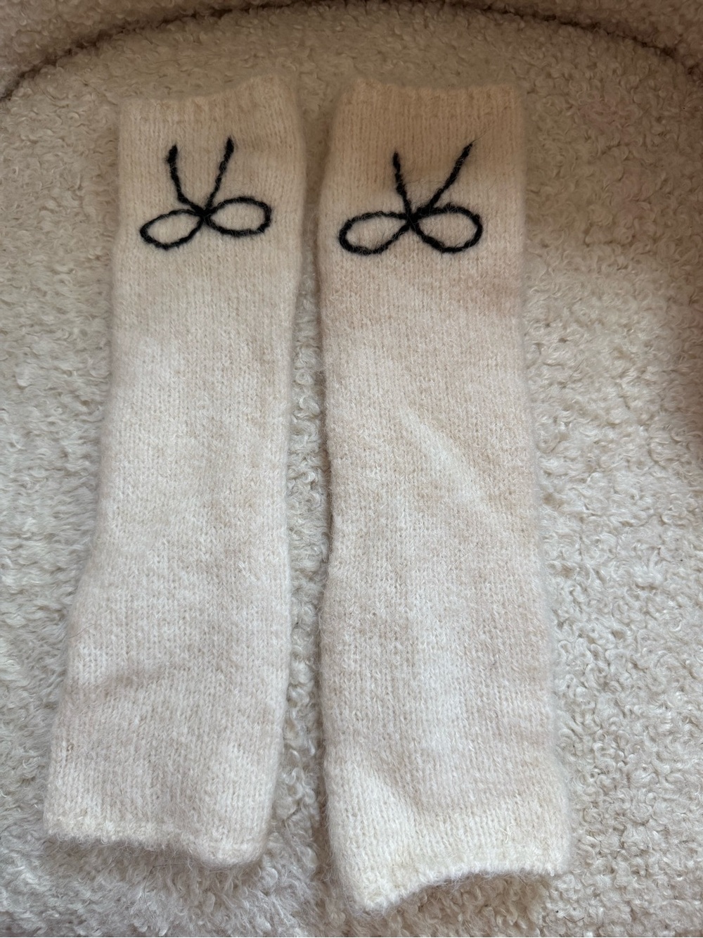 3/$20. Cozy Knit Wrist Warmers with Black Bow Detail